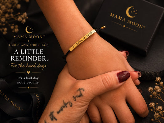 Mama Moon A Little Reminder engraved bracelet with black cord and gold-tone bar